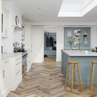 blue and cream kitchen units in large room