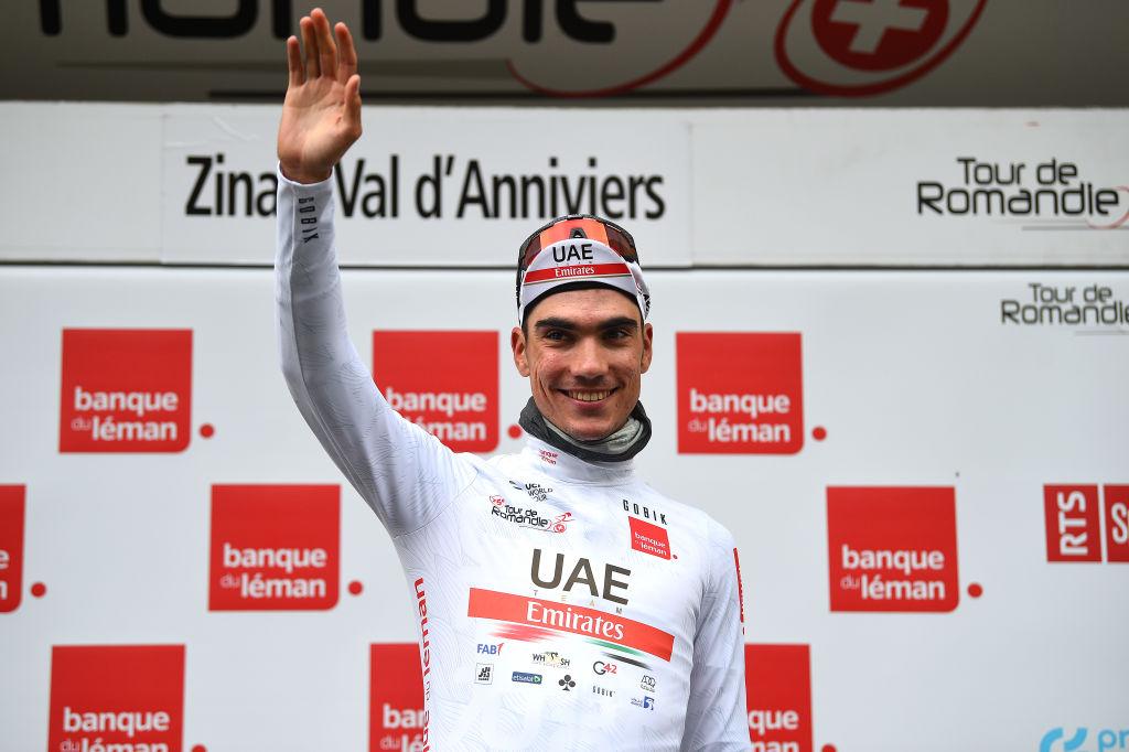 ZINAL VAL DANNIVIERS SWITZERLAND APRIL 30 Juan Ayuso Pesquera of Spain and UAE Team Emirates celebrates at podium as White Best Young Rider Jersey winner during the 75th Tour De Romandie 2022 Stage 4 a 1801km stage from Aigle to Zinal Val dAnniviers 1664m TDR2022 on April 30 2022 in Zinal Val dAnniviers Switzerland Photo by Dario BelingheriGetty Images