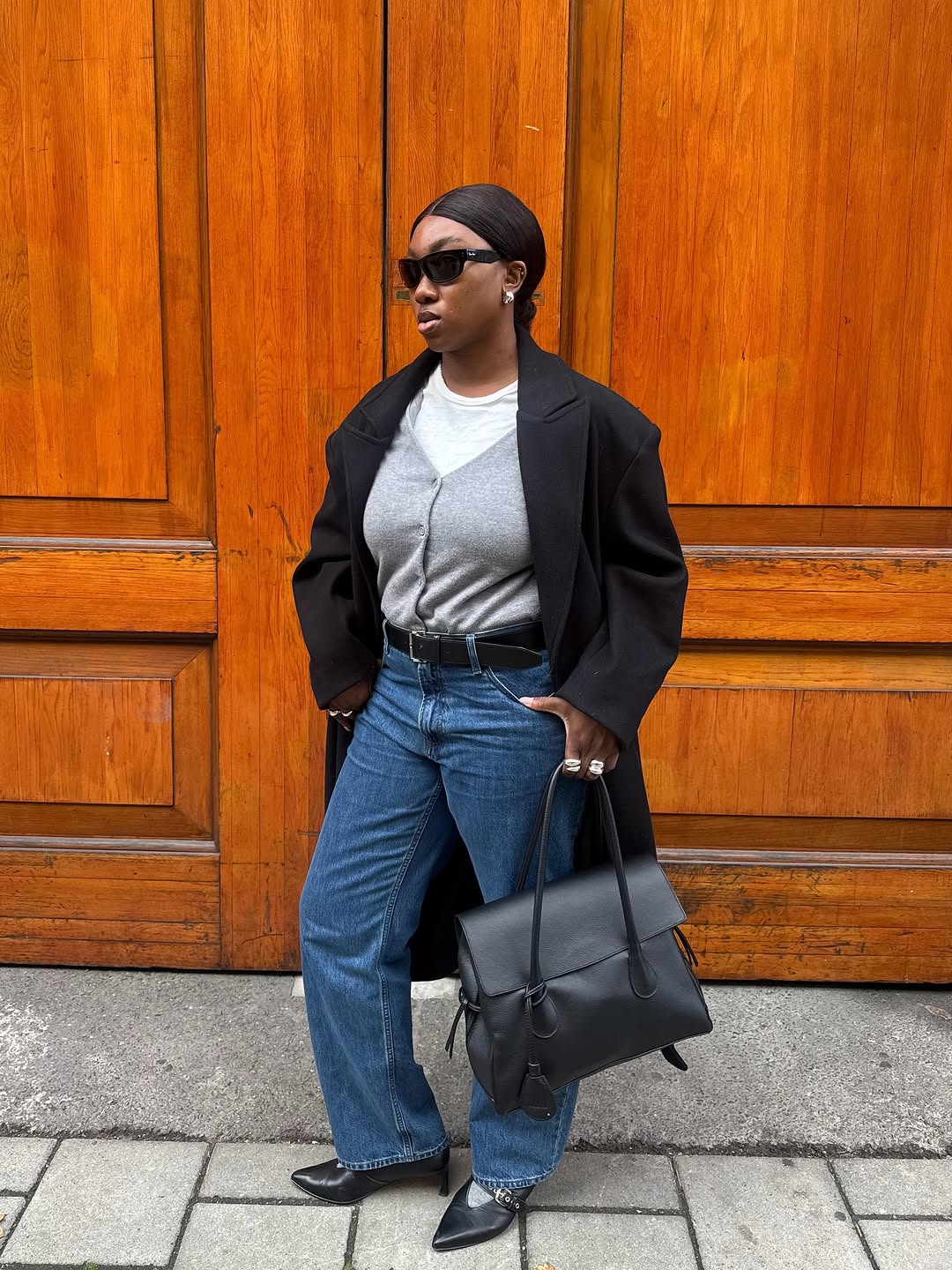 woman wearing gray sweater spring outfit 2026