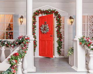 red front door with festive decor