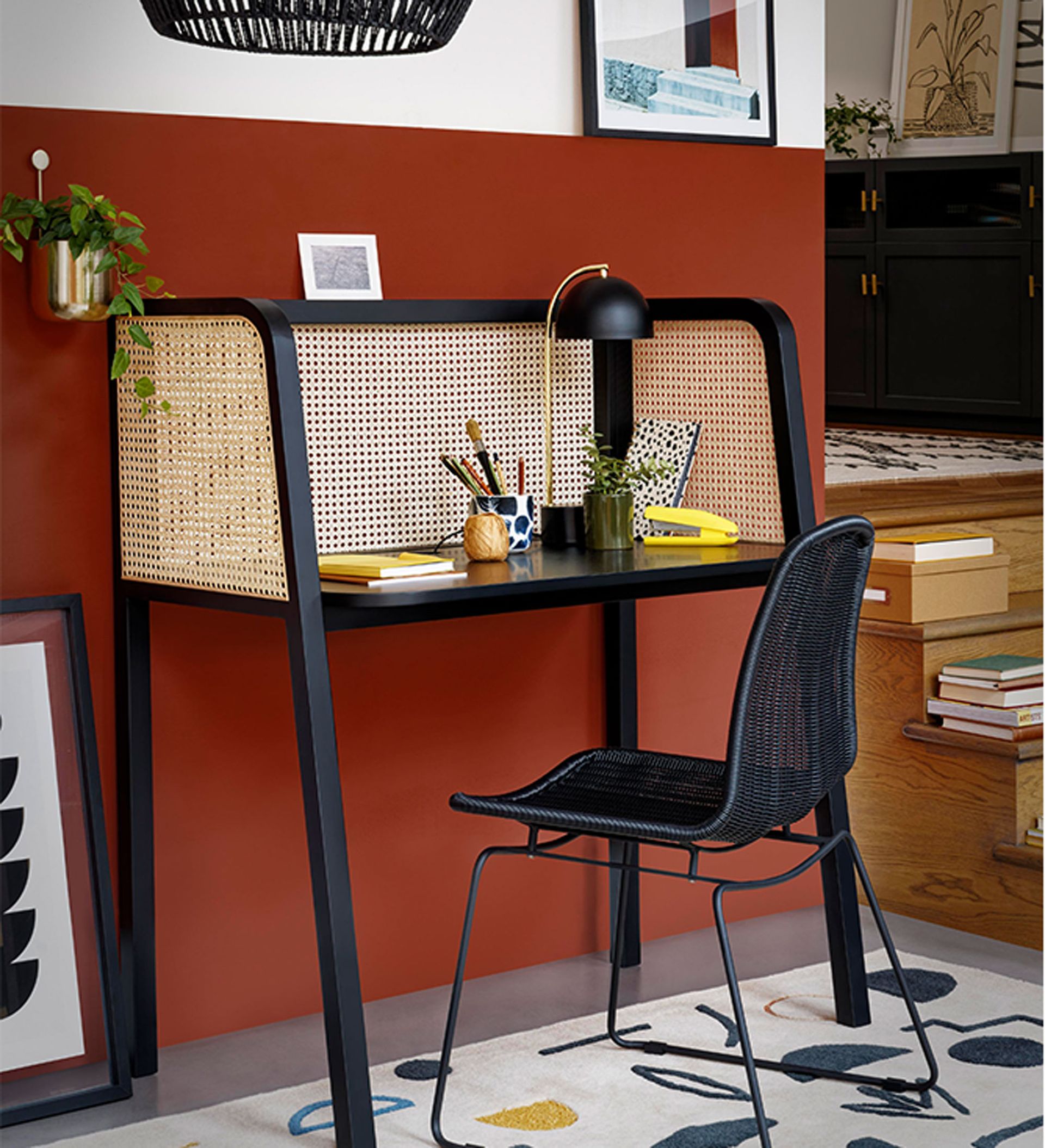 Home office layout ideas with red wall and hutch desk