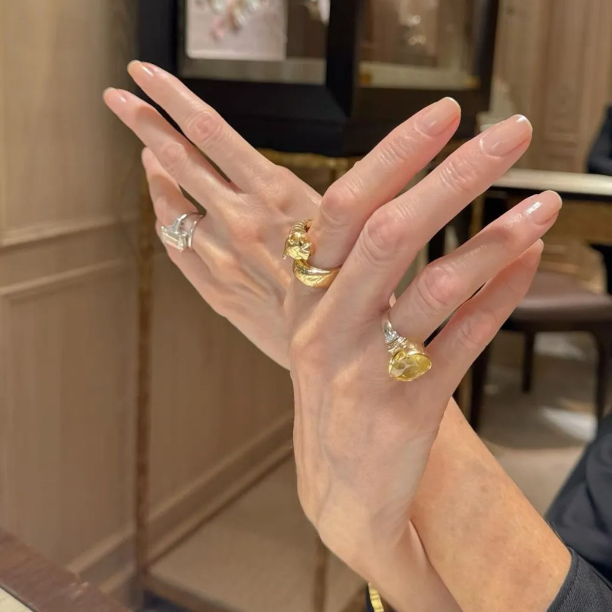 A close-up shot of a clear, glossy manicure