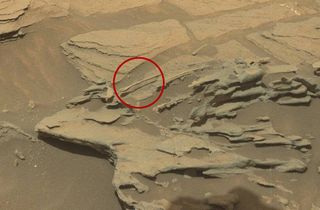 Is that really a floating spoon on Mars? No, but this photo from NASA's Mars rover Curiosity this week does show a weird rock that looks like a floating spoon. It was likely sculpted by Martian winds, NASA says.