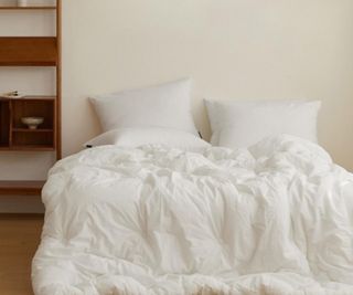 Maatila comforter on a bed.