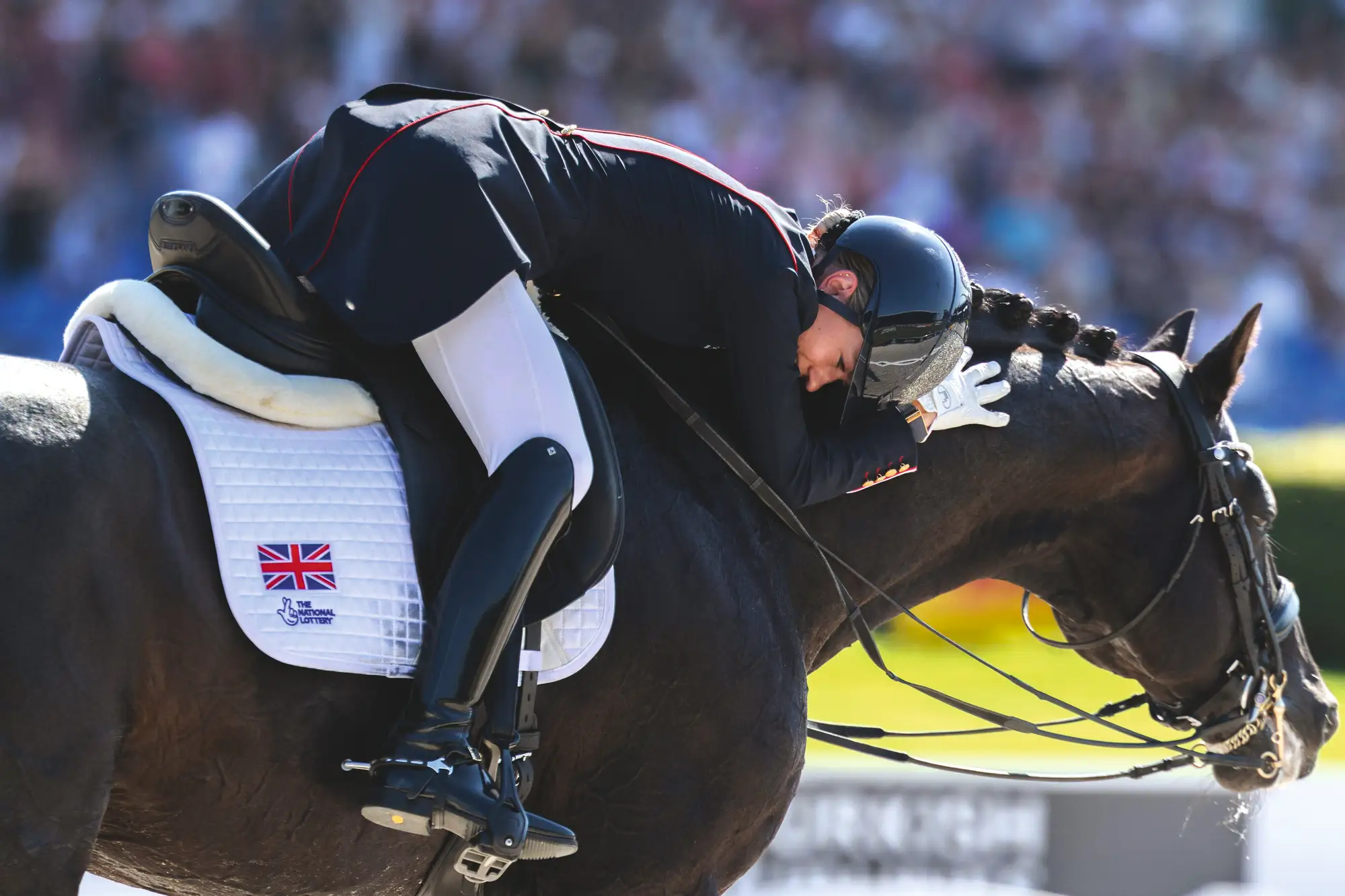 Lottie Fry leaning down on Glamourdale&amp;rsquo;s neck following dressage test