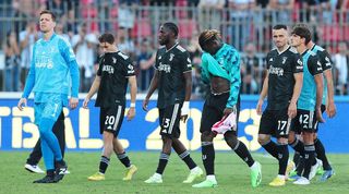 Juventus players look dejected after defeat to Monza in Serie A.