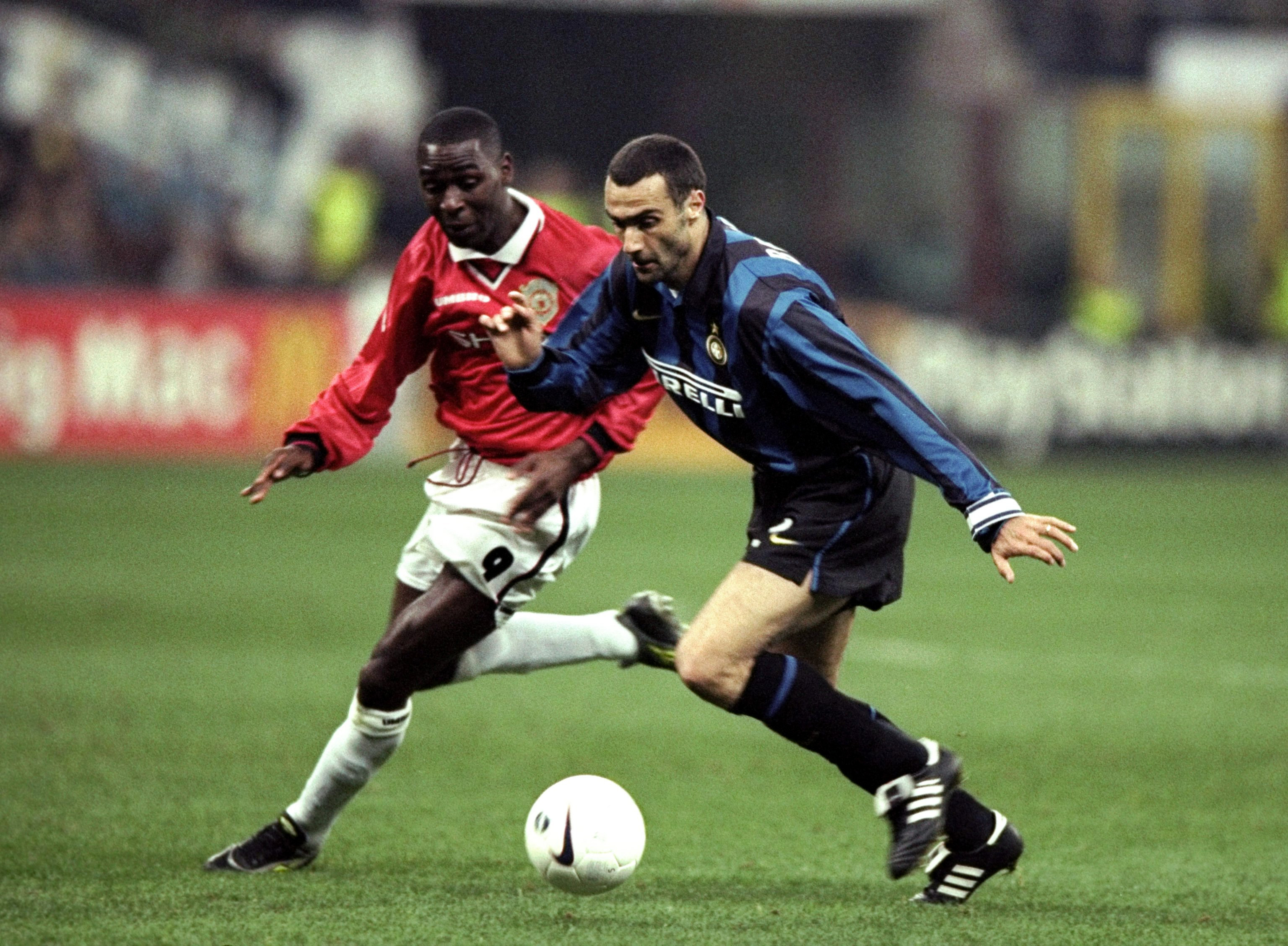 Inter's Giuseppe Bergomi is challenged by Manchester United's Andy Cole in a Champions League clash in March 1999.