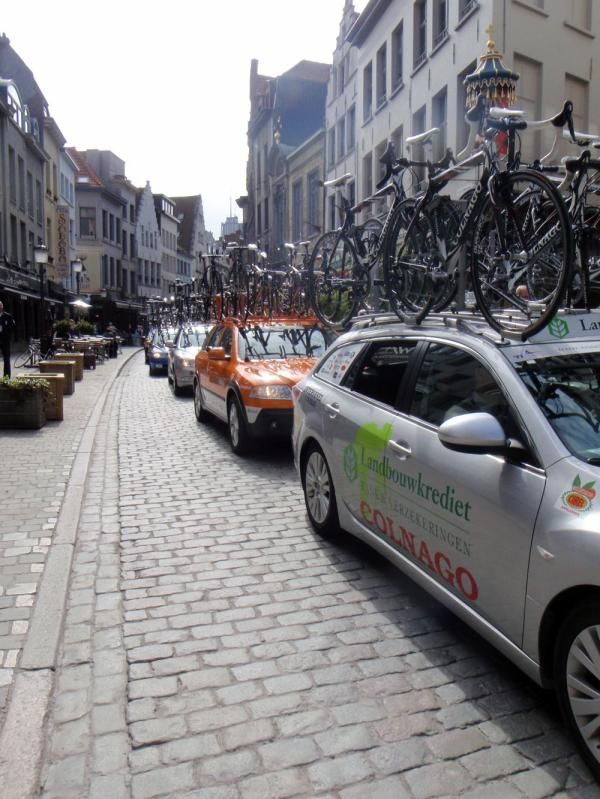 Team cars wait for their signal to go
