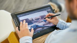 Best Wacom tablets person using a Wacom tablet to draw
