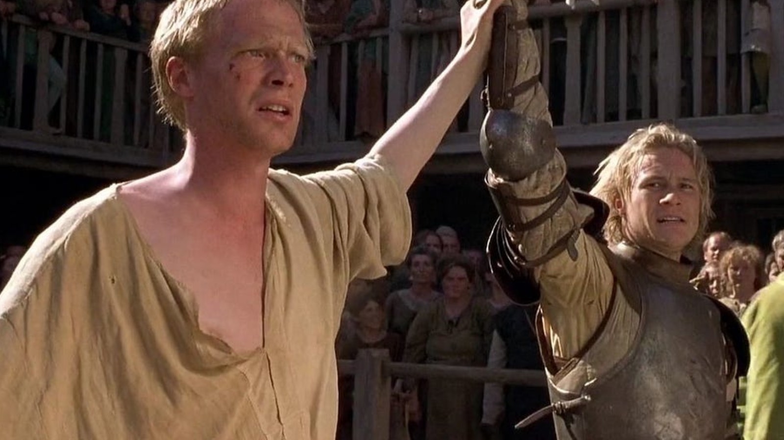 Paul Bettany and Heath Ledger hand in hand in A Knights Tale 