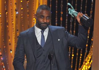 Idris Elba takes home a gong for Beasts Of No Nation (Vince Bucci/AP)
