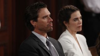 Joshua Morrow and Amelia Heinle as Nick and Victoria sitting next to each other in The Young and the Restless