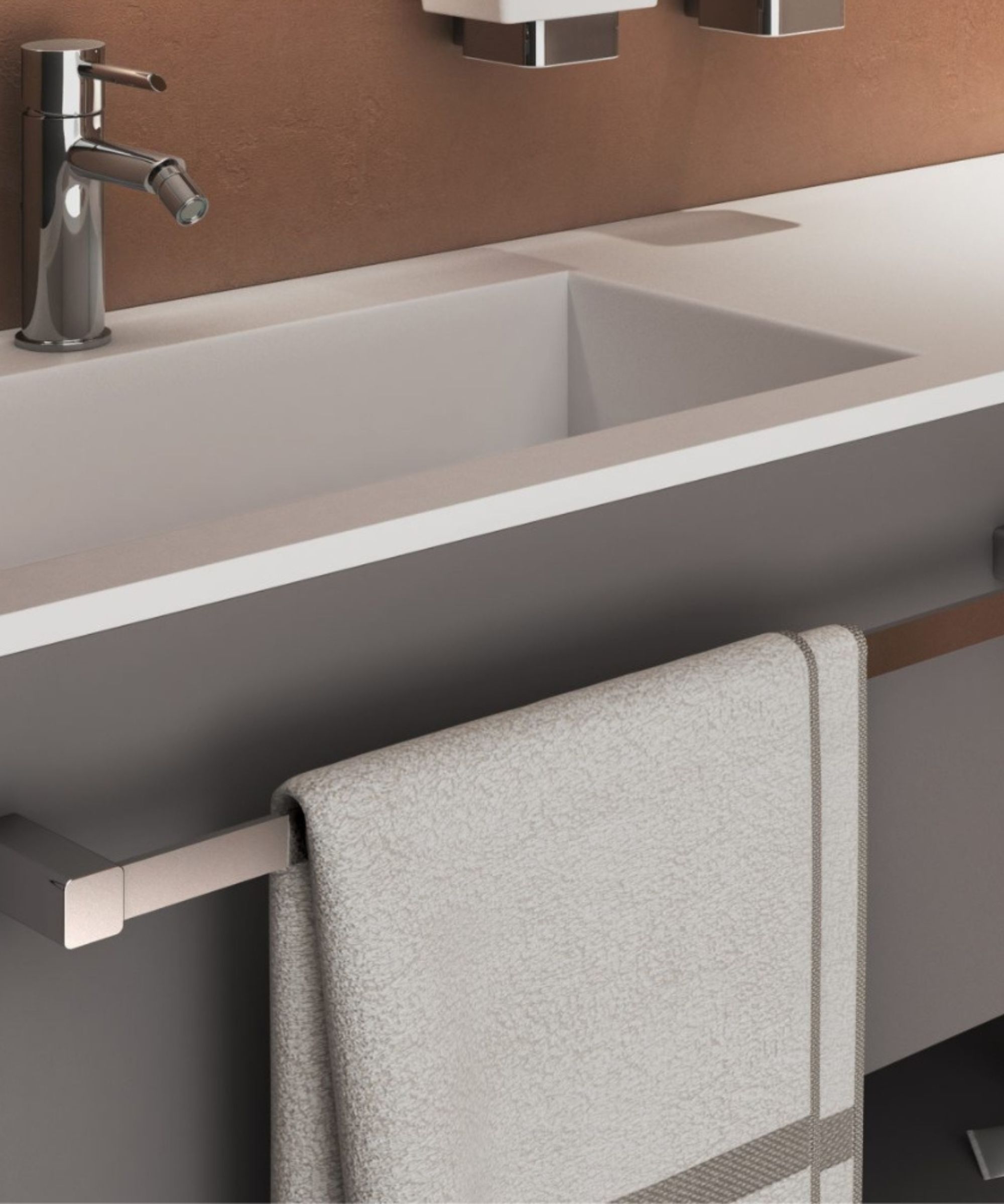 A streamlined towel rail is integrated beneath a floating vanity, keeping a neatly folded towel within easy reach. Clean lines and muted tones give the space a modern finish.