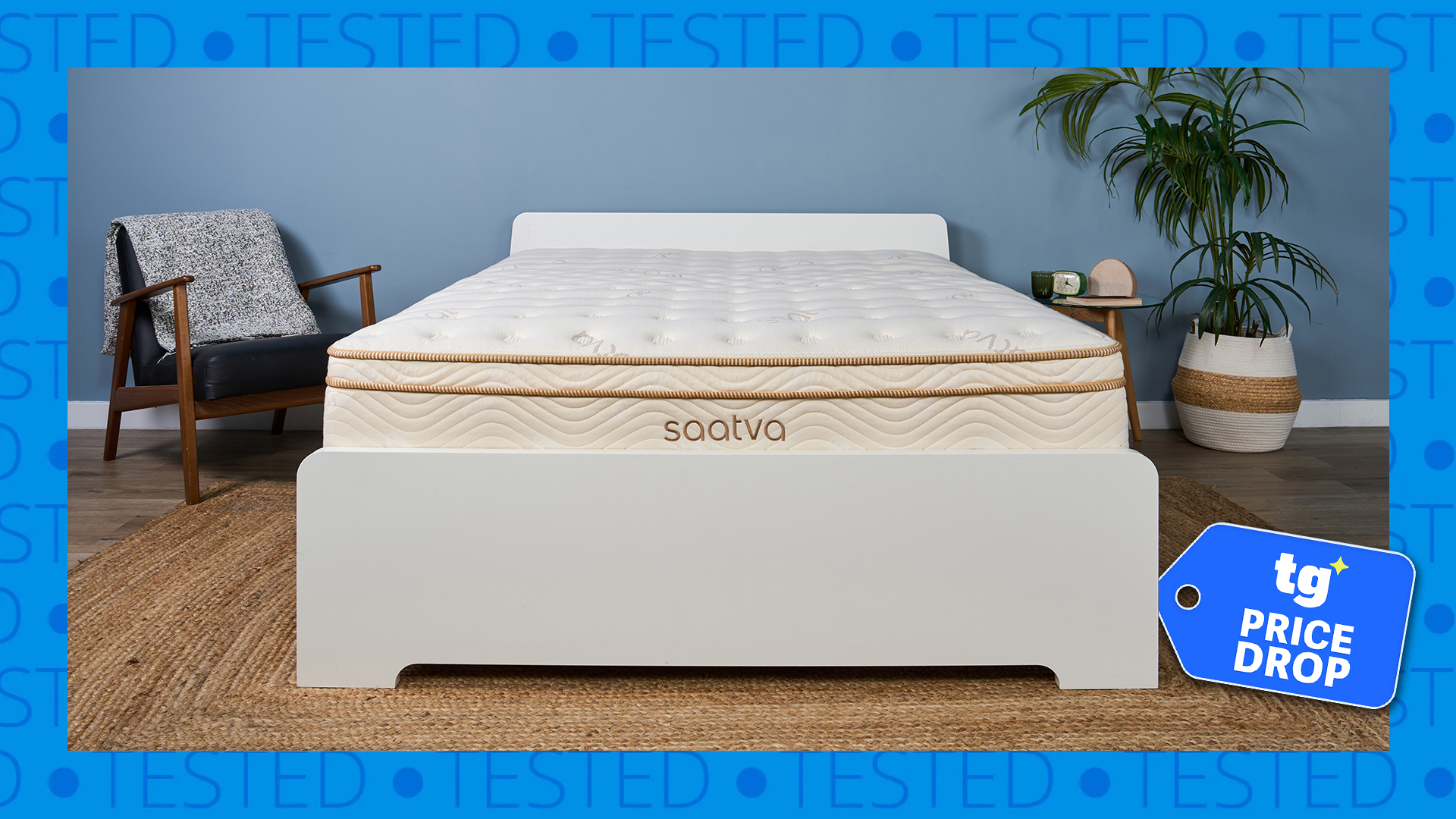 A Saatva Classic mattress on a bed frame in the Tom's Guide Sleep Studio. A blue border saying 'tested' surrounds it. There's a Tom's Guide price drop deals badge in the bottom right corner