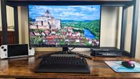Lenovo Legion R27fc-30 on desk with monitor lower on stand. 
