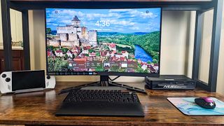 Lenovo Legion R27fc-30 on desk with monitor lower on stand. 