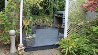 painted decking surrounded by trellis