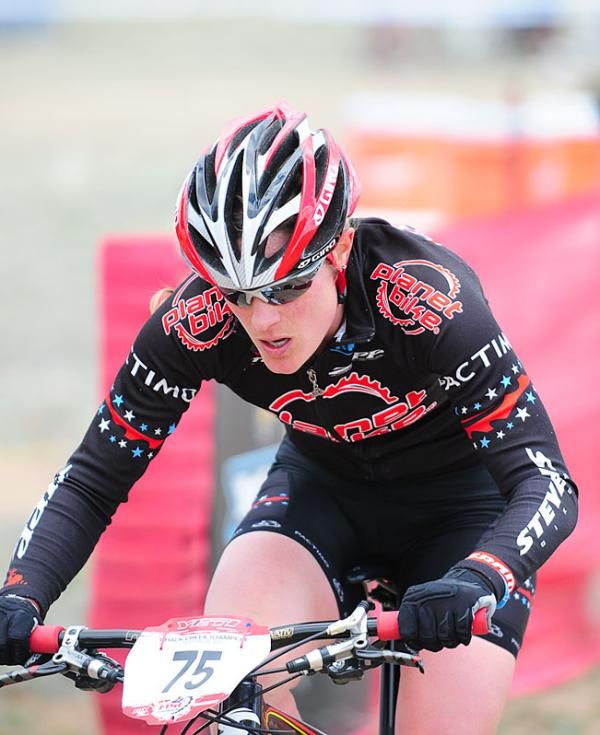 Katie Compton (Planet Bike) hammering out of the saddle.