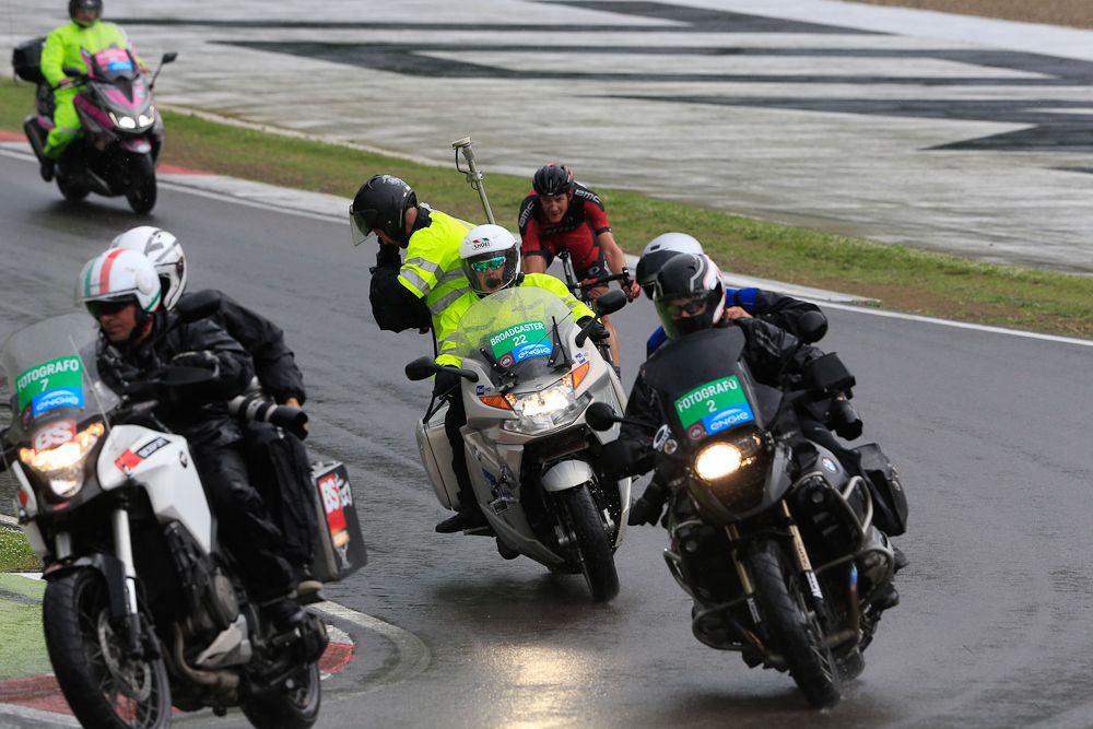 Motos traverse the slick track in Imola