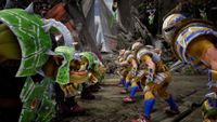 An orc team and a human team face off in a game of Blood Bowl