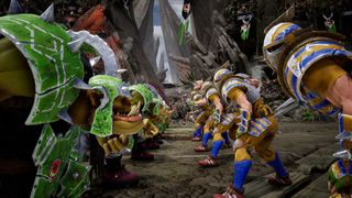 An orc team and a human team face off in a game of Blood Bowl