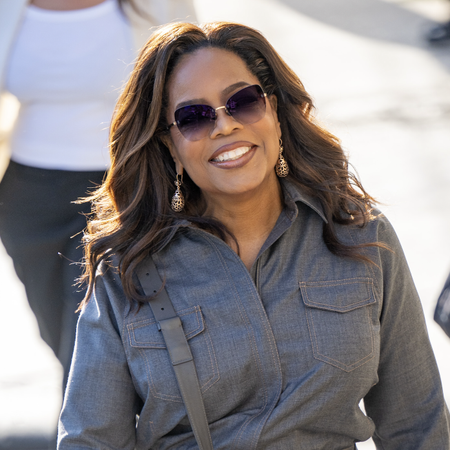 Oprah Winfrey is seen at "Jimmy Kimmel Live" on September 17, 2024 in Los Angeles, California wearing chloe sneakers and a denim jumpsuit