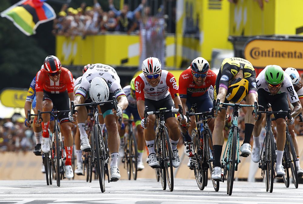 Mike Teunissen (Jumbo-Visma) beats Peter Sagan (Bora-Hansgrohe) and Caleb Ewan (Lotto Soudal) to win the opening stage at the Tour de France in Brussels