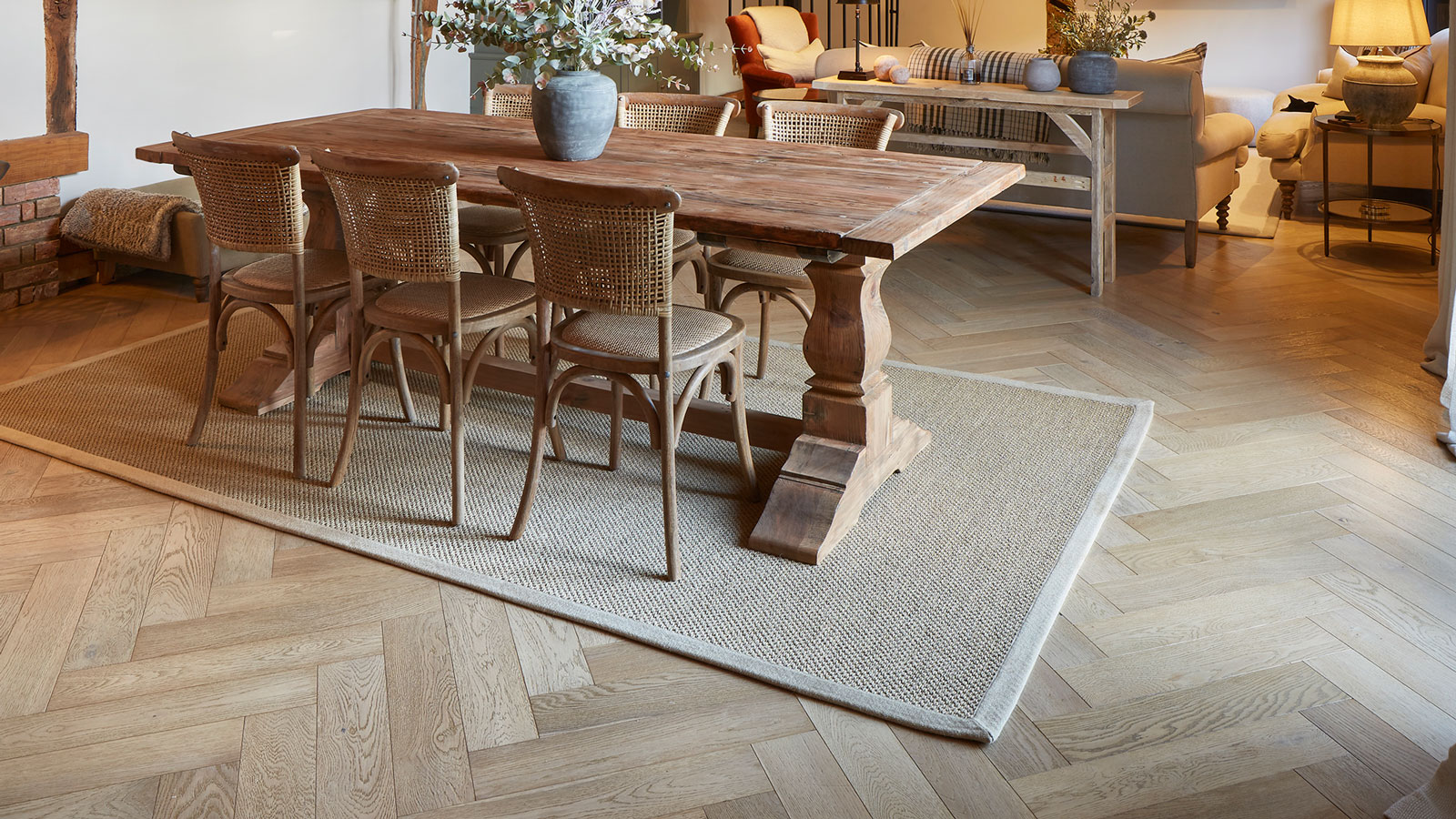 dining room in barn conversion with herringbone engineered timber flooring