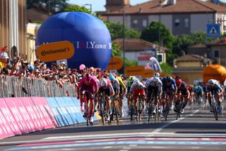 Best sprinter's cyclamen jersey Team Lidl-Trek's Italian rider Jonathan Milan (L) sprints to win the 13th stage of the 107th Giro d'Italia cycling race, 179km between Riccione and Cento, on May 17, 2024. (Photo by Luca Bettini / AFP)