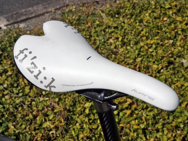 Mechanics mark a specific location on top of the saddle for better accuracy when setting up the rider's fit measurements.