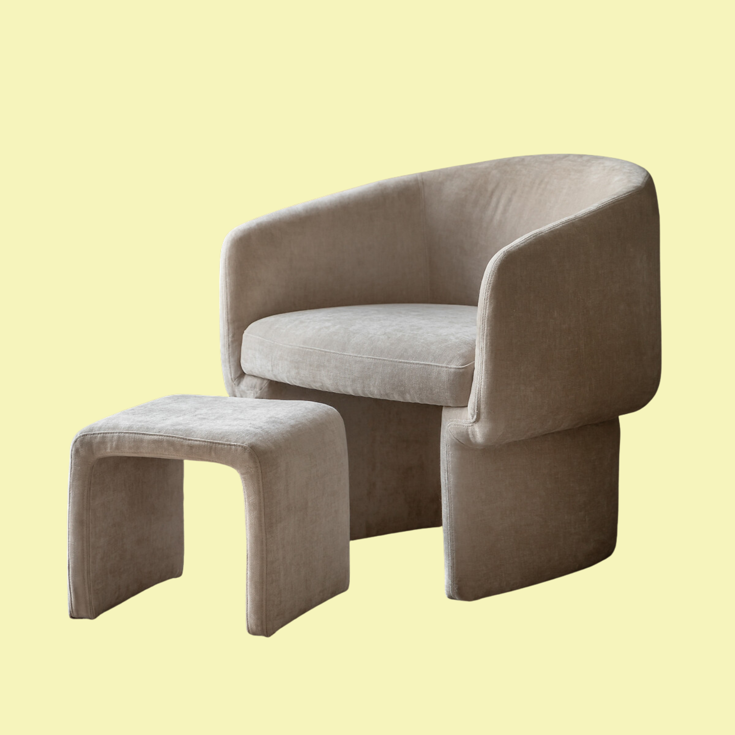 A soft beige chair and footstool