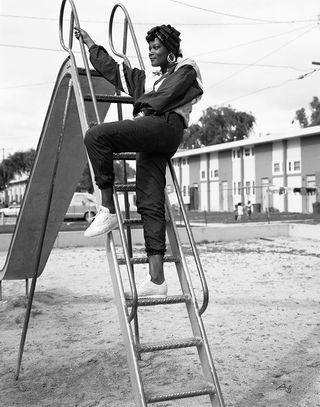 A person climbing for sliding