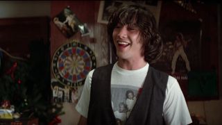 Keanu Reeves smiling in Bill and Ted's Excellent Adventure