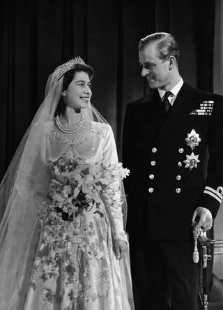 Queen Elizabeth II with her husband Phillip, Duke of Edinburgh, on their wedding day,