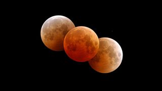 During a total lunar eclipse, the moon can take on a red tinge depending on atmospheric conditions.