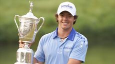 Rory McIlroy win the US Open trophy after his 2011 success