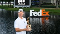 Justin Rose holds the FedEx St. Jude Championship trophy