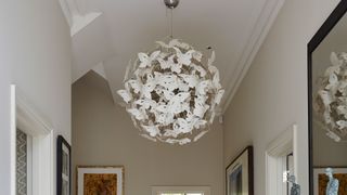 hallwayway with statement butterfly light to consider as an interior design feature that could help sell your house