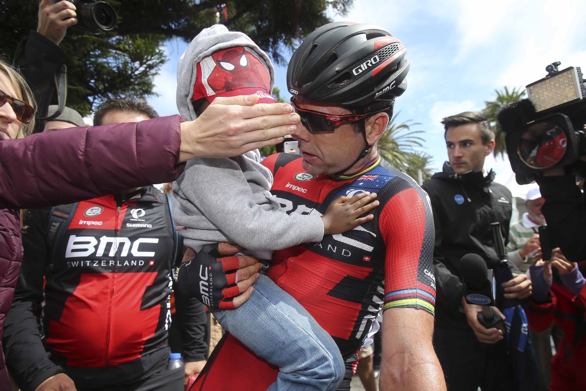 Cadel Evans with his son Robel after the race
