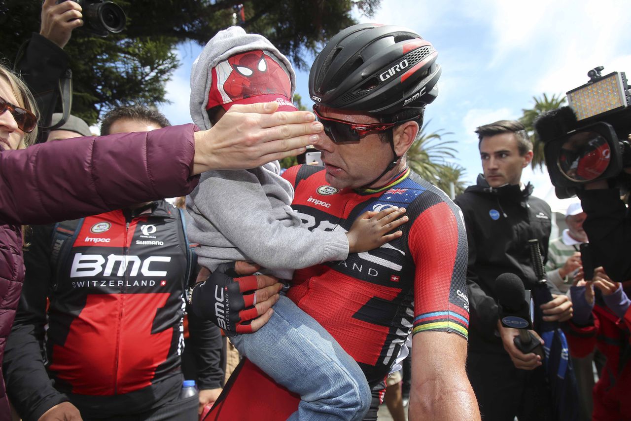 Cadel Evans with his son Robel after the race