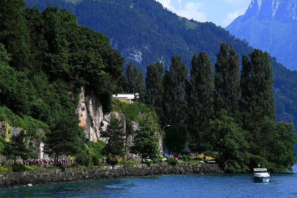 BRUNNEN SWITZERLAND JUNE 15 A general view of the peloton compete passing through lake Lucerna during the 85th Tour de Suisse 2022 Stage 4 a 1908km stage from Grenchen to Brunnen ourdesuisse2022 WorldTour on June 15 2022 in Brunnen Switzerland Photo by Tim de WaeleGetty Images
