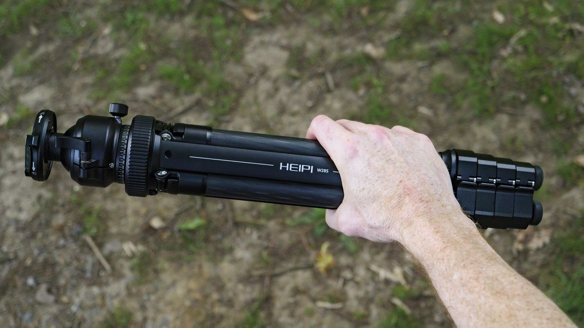 Heipi 3-in-1 Travel Tripod W28S folded away, in the hand