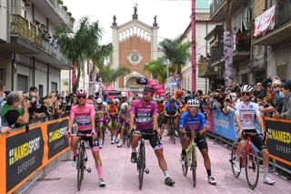 CAMIGLIATELLO SILANO ITALY OCTOBER 07 Start Joao Almeida of Portugal and Team Deceuninck QuickStep Pink Leader Jersey Peter Sagan of Slovakia and Team Bora Hansgrohe Purple Points Jersey Jonathan Caicedo Cepeda of Ecuador and Team EF Pro Cycling Blue Mountain Jersey Harm Vanhoucke of Belgium and Team Lotto Soudal White Best Young Jersey Peloton Public Fans Church Mileto City Landscape during the 103rd Giro dItalia 2020 Stage 5 a 225km stage from Mileto to Camigliatello Silano 1275m girodiitalia Giro on October 07 2020 in Camigliatello Silano Italy Photo by Tim de WaeleGetty Images
