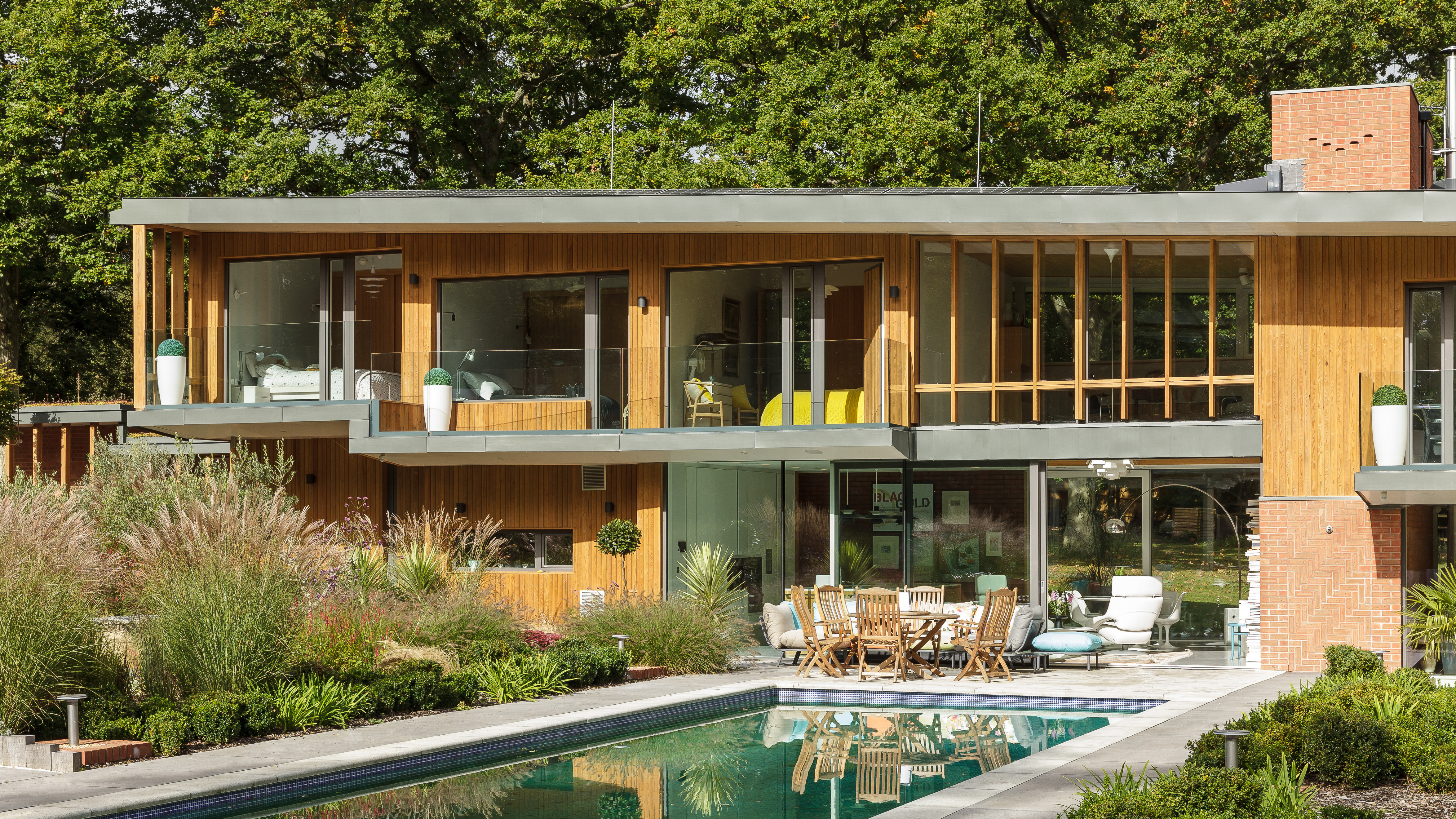 modern home with brick and timber cladding and swimming pool