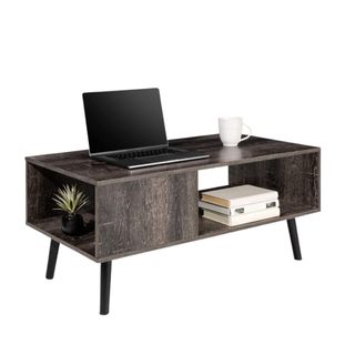 A dark gray rectangular coffee table with a laptop on it