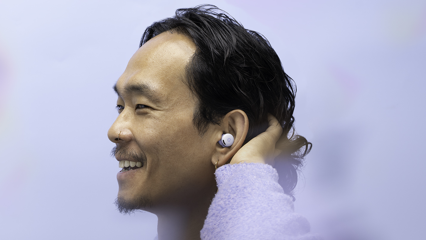 A man wearing the Google Pixel Buds 2a