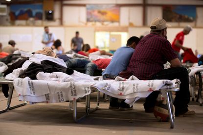 Migrants in a shelter at the Southwestern New Mexico State Fairgrounds.
