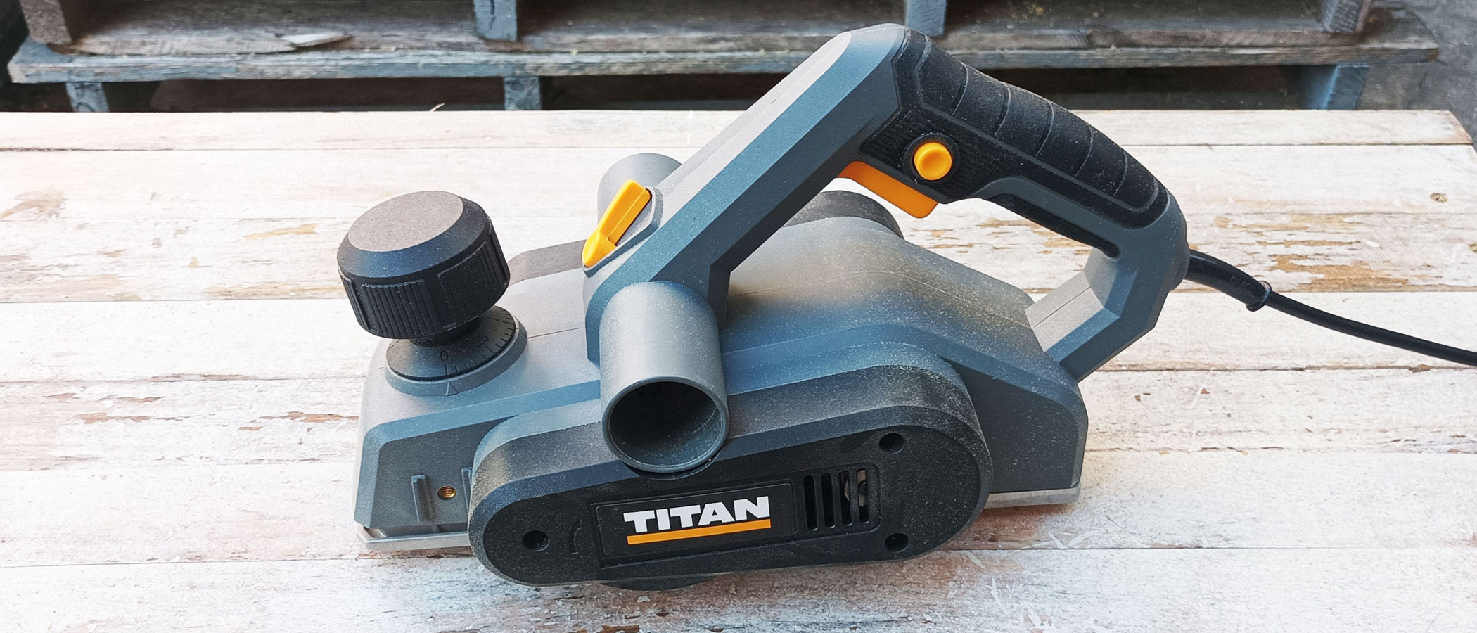 Titan TTB876PLN 3mm Electric Planer on whitewashed wood background