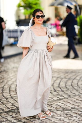 Street style attendee wearing a linen dress