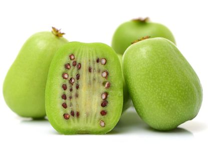 Whole And Sliced Kiwi Fruit